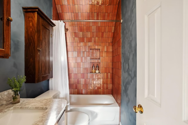 bathroom featuring toilet, shower / bath combo, and vanity