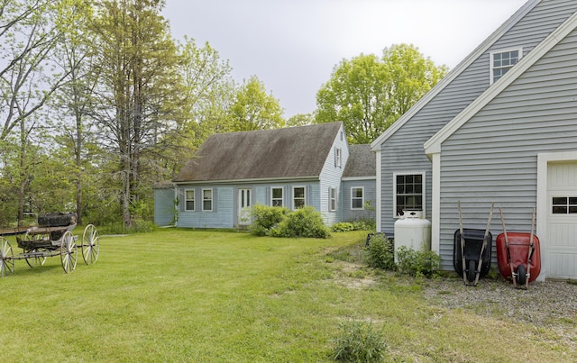535 Main St, Damariscotta, ME 04543 - rear view of property with a garage, a yard, and a shingled roof
