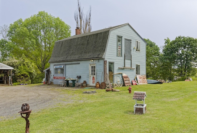 535 Main St, Damariscotta, ME 04543 - back of house with a shingled roof, a gambrel roof, a chimney, and a yard