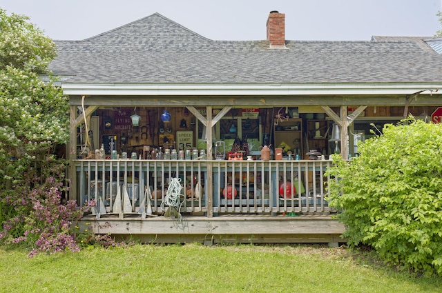 535 Main St, Damariscotta, ME 04543 - rear view of property featuring a chimney, a shingled roof, and a yard