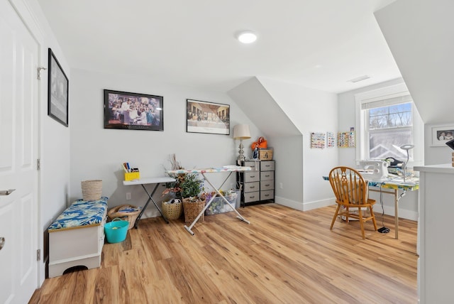 office space with visible vents, baseboards, and wood finished floors