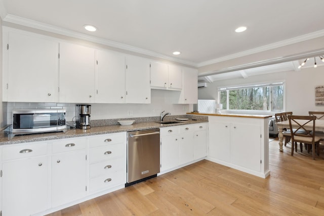 kitchen with white cabinetry, recessed lighting, light wood-type flooring, and appliances with stainless steel finishes