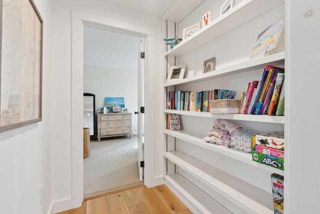 corridor featuring wood finished floors