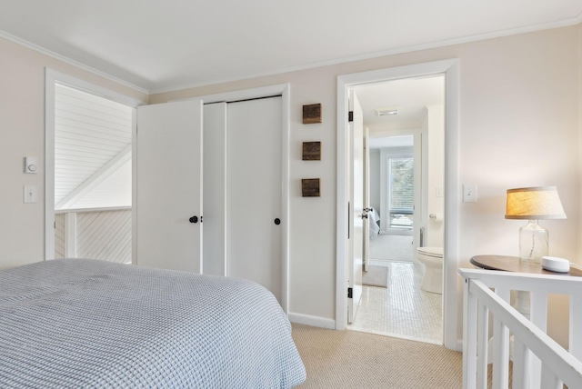 bedroom featuring light colored carpet, a closet, and ornamental molding