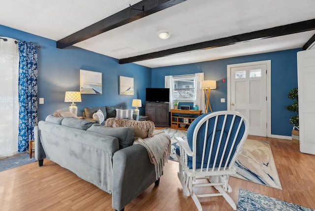 35 Grove Ave, Old Orchard Beach, ME 04064 - living room featuring beam ceiling, baseboards, and wood finished floors