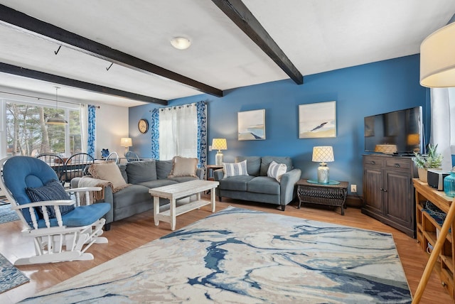 35 Grove Ave, Old Orchard Beach, ME 04064 - living area with beamed ceiling and light wood-type flooring