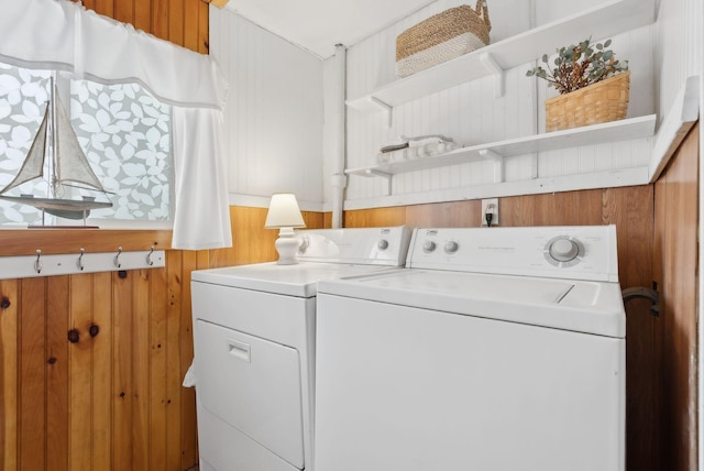35 Grove Ave, Old Orchard Beach, ME 04064 - laundry room with washer and dryer, wood walls, and laundry area
