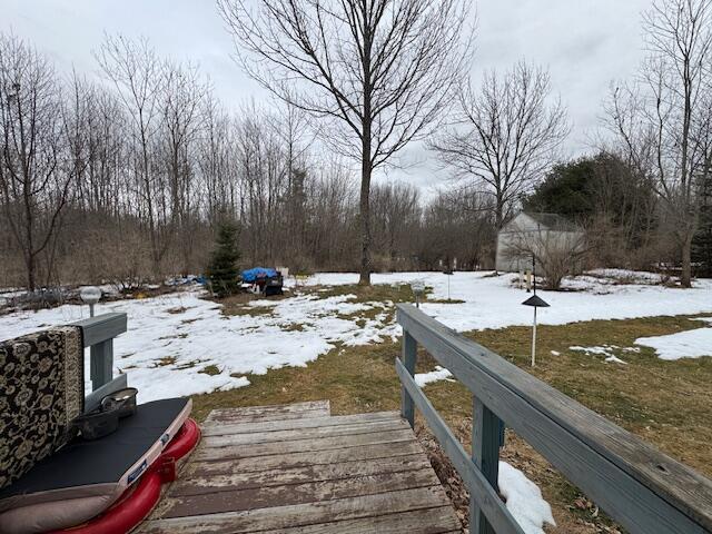 view of yard layered in snow