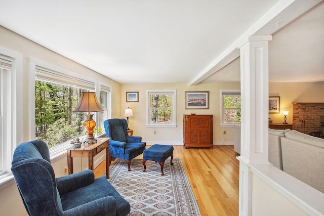 101 Whites Bridge Rd, Windham, ME 04062 - living area with light wood-type flooring, baseboards, and decorative columns
