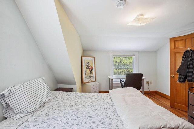 101 Whites Bridge Rd, Windham, ME 04062 - bedroom with lofted ceiling, baseboards, and wood finished floors