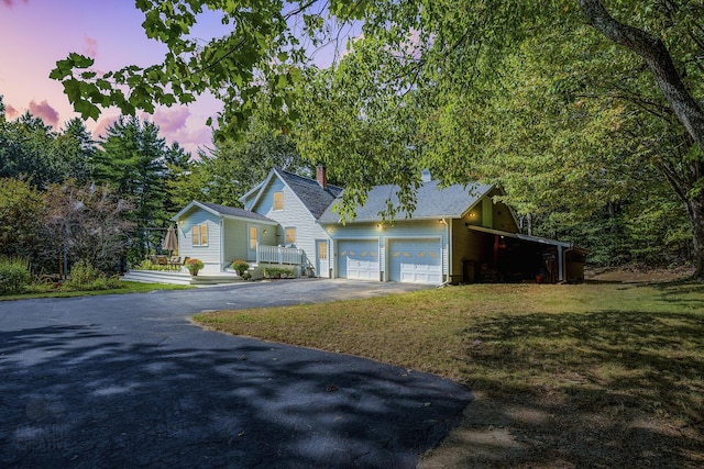101 Whites Bridge Rd, Windham, ME 04062 - view of front facade with driveway, a yard, a garage, a chimney, and roof with shingles