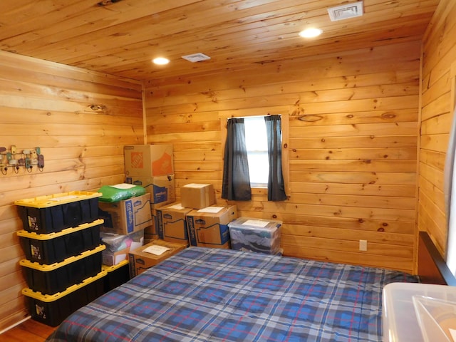 bedroom featuring wooden ceiling, recessed lighting, visible vents, and wood walls