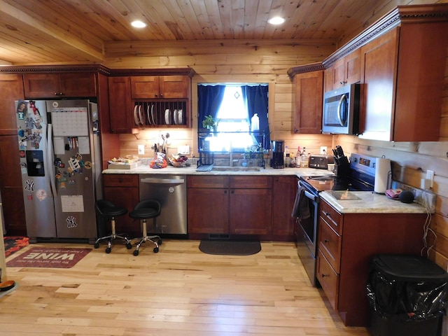 kitchen with recessed lighting, a sink, stainless steel appliances, wood ceiling, and light wood-type flooring