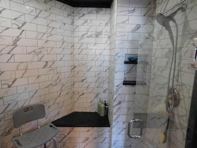 bathroom with a shower stall