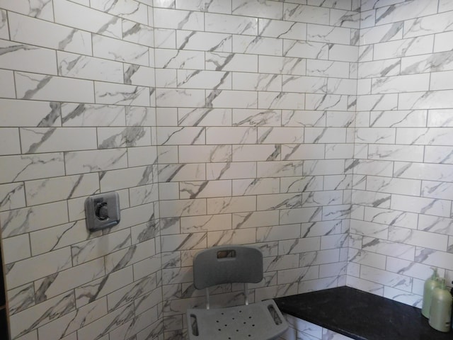 bathroom with tiled shower