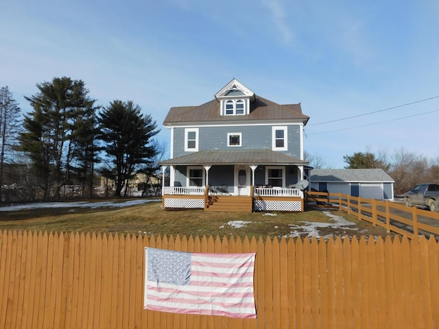 view of front of property with covered porch and fence