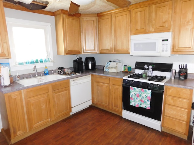 kitchen featuring a sink, white appliances, dark wood-style floors, and light brown cabinets