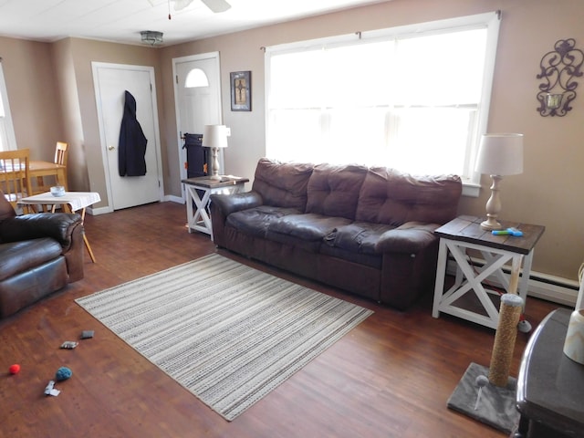 living area with a healthy amount of sunlight, a ceiling fan, and wood finished floors