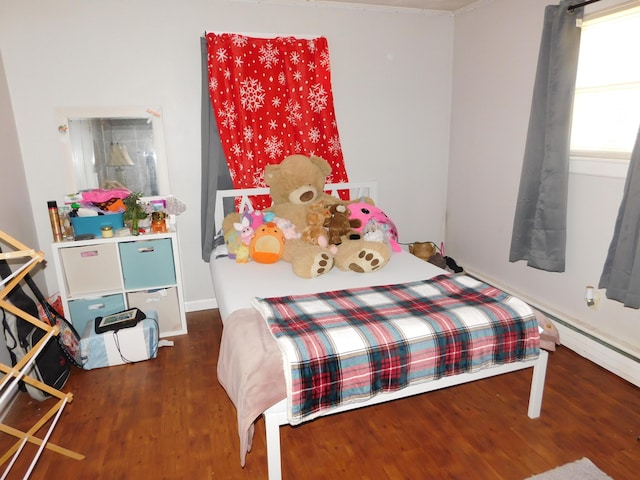 bedroom with wood finished floors