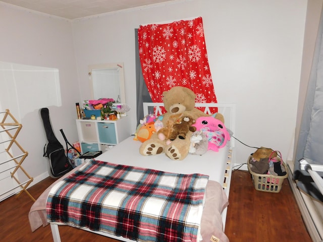 bedroom with wood finished floors