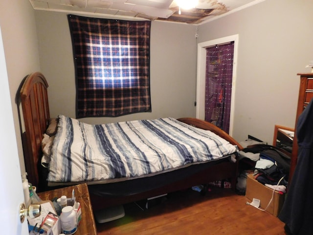 bedroom with wood finished floors