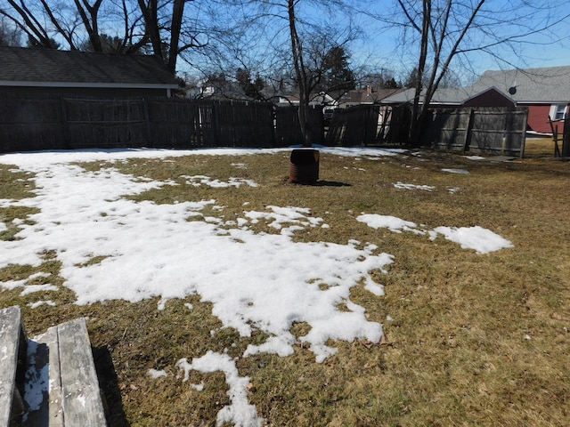 yard covered in snow with fence