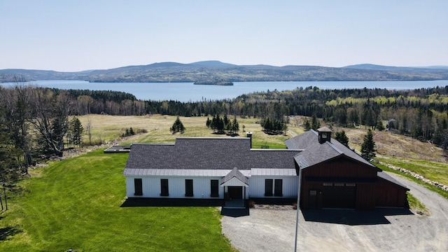 3062 Main St, Rangeley, ME 04970 - aerial view of property and surrounding area featuring a water and mountain view and a heavily wooded area