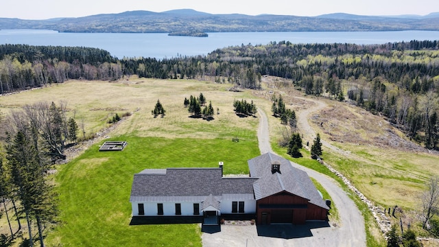3062 Main St, Rangeley, ME 04970 - view of subject property featuring a heavily wooded area and a water and mountain view
