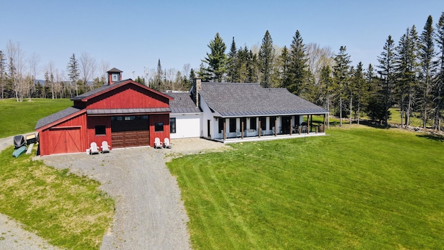 3062 Main St, Rangeley, ME 04970 - view of front of home featuring a front yard, gravel driveway, metal roof, and a standing seam roof