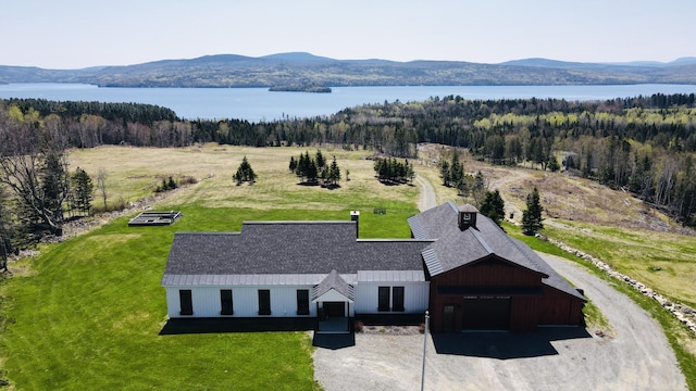 3062 Main St, Rangeley, ME 04970 - view of subject property with a water and mountain view and a heavily wooded area