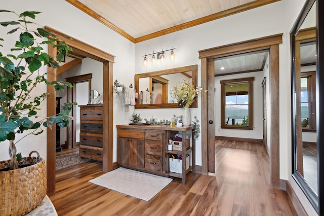 3062 Main St, Rangeley, ME 04970 - bathroom featuring crown molding, wood finished floors, vanity, and wood ceiling