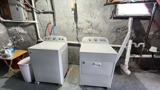 laundry room featuring laundry area, electric panel, and separate washer and dryer