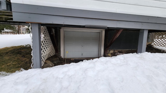 view of snow covered garage