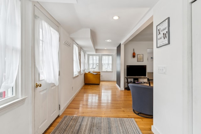 foyer featuring recessed lighting, baseboards, and light wood finished floors