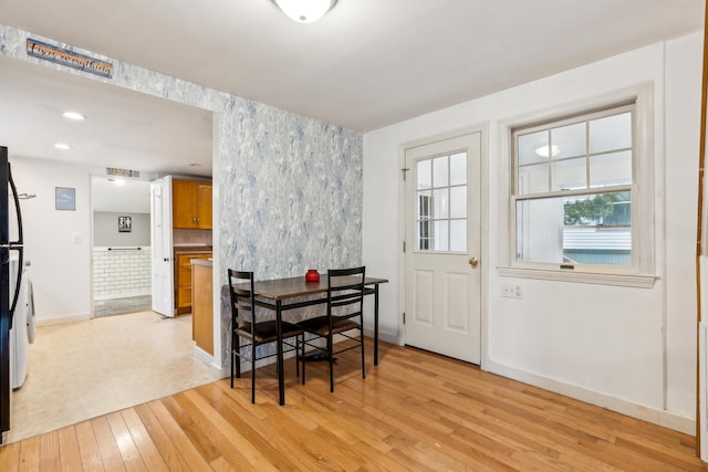 dining area with recessed lighting, baseboards, and light wood-type flooring