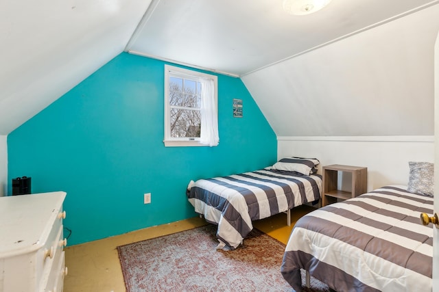 bedroom featuring lofted ceiling