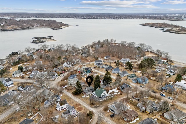 drone / aerial view with a residential view and a water view