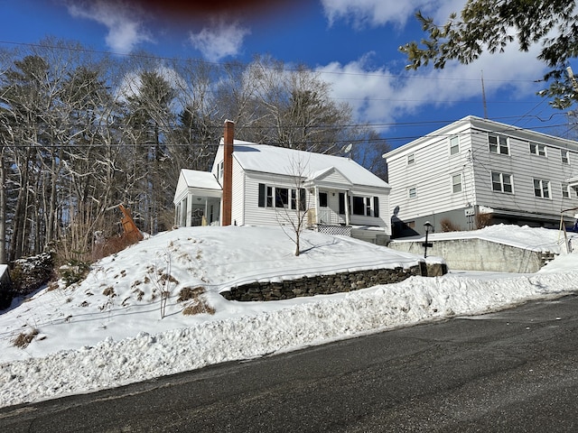 view of front facade with a chimney