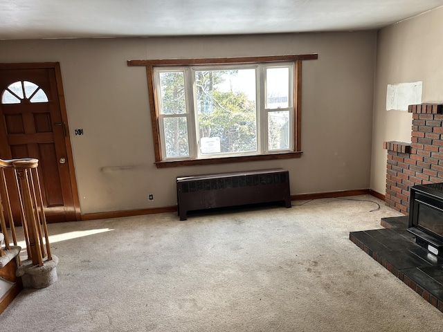 carpeted living room with radiator and baseboards