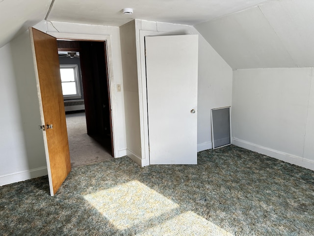 bonus room with lofted ceiling, radiator, carpet flooring, and baseboards