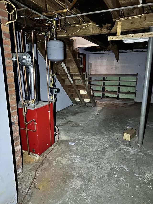 unfinished basement featuring stairway