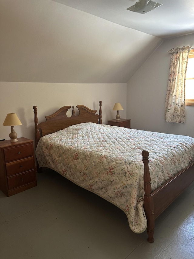 bedroom with lofted ceiling