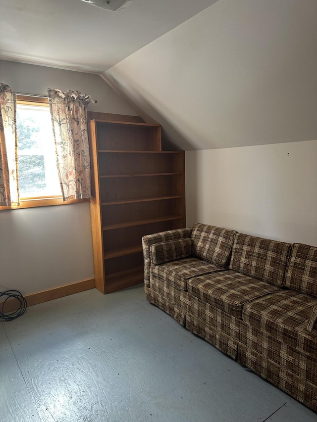 additional living space with lofted ceiling and baseboards