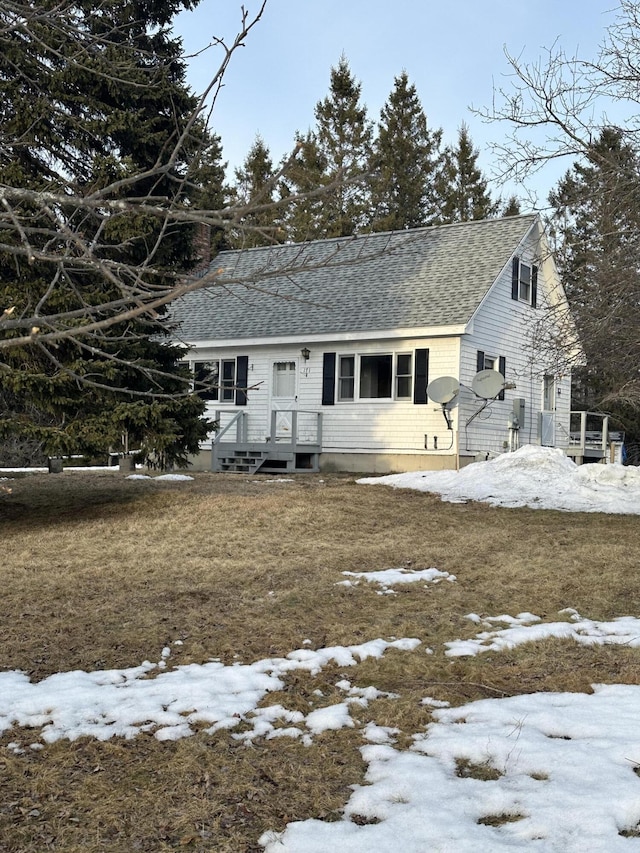 view of front of house featuring a shingled roof