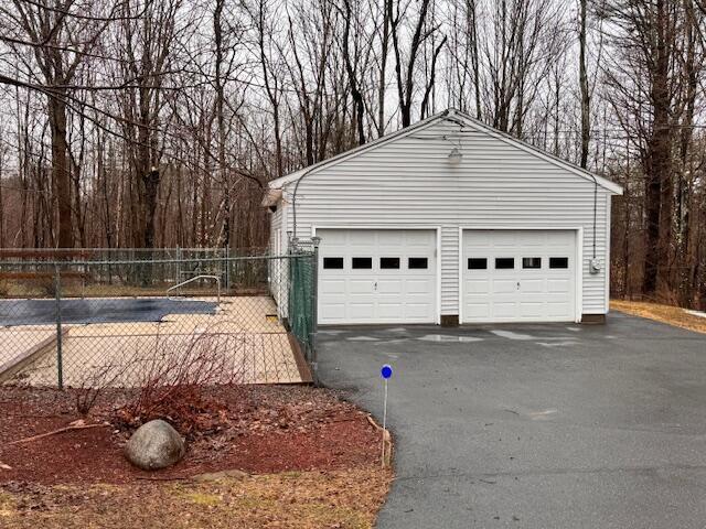detached garage with fence