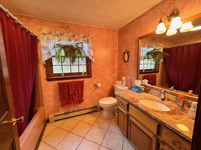 bathroom featuring a textured ceiling, toilet, tile patterned floors, vanity, and a baseboard heating unit