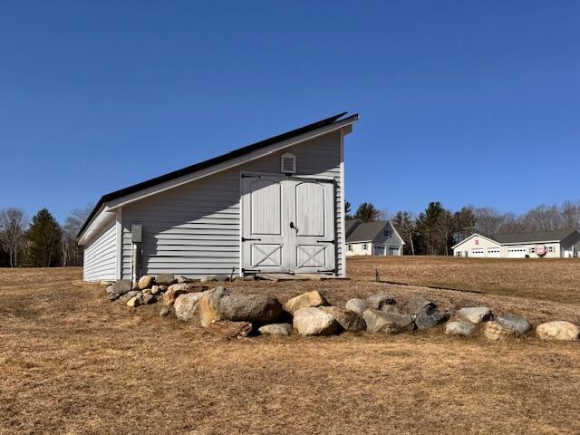 view of home's exterior featuring an outdoor structure