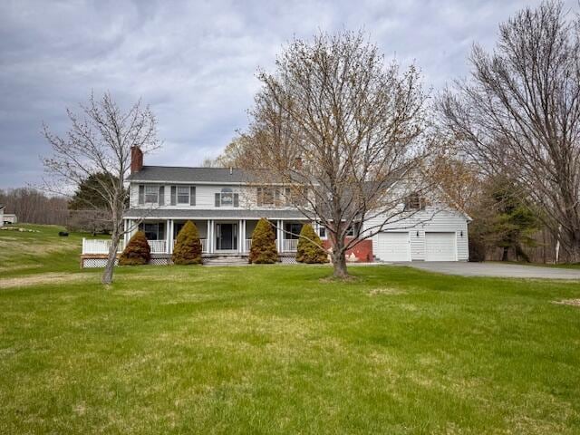 195 Palmer Rd, Skowhegan, ME 04976 - view of front of house featuring covered porch, a front yard, a chimney, and driveway