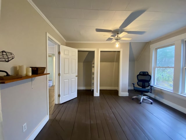 unfurnished room with dark wood-style flooring, baseboards, ornamental molding, and ceiling fan
