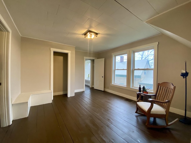 sitting room featuring baseboards, dark wood finished floors, and visible vents